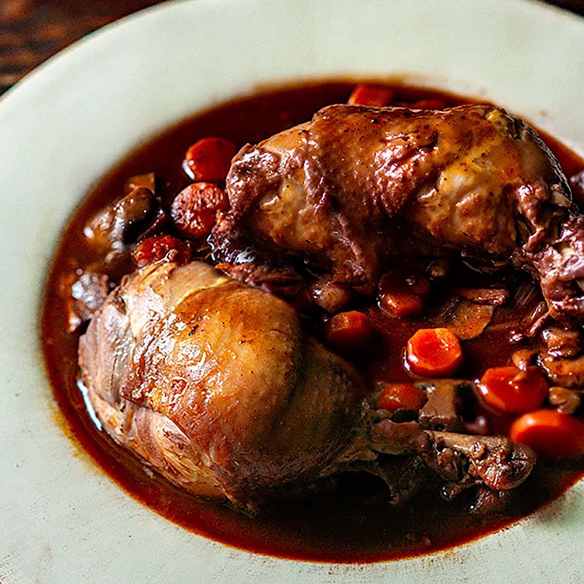 Coq au vin with red wine braise, carrots, and mushrooms